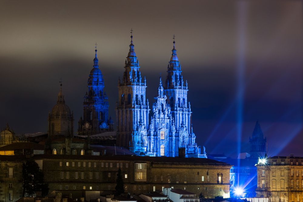 Majestic Gothic cathedral with blue illumination in night time