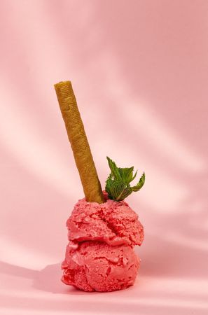 Strawberry ice cream scoops with waffle stick