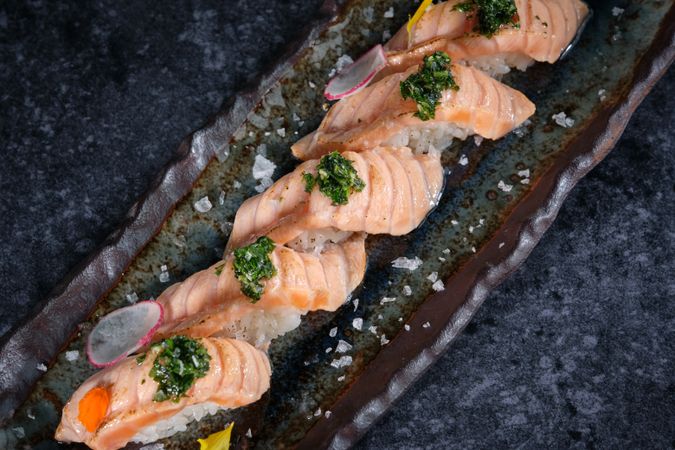 Delicious sushi served on plate in restaurant