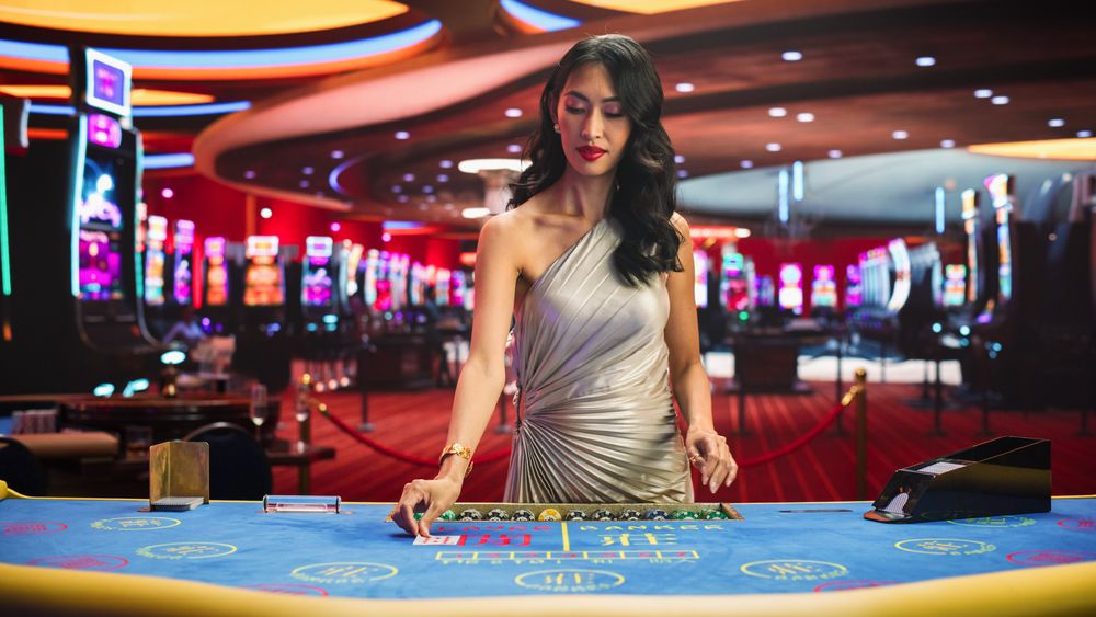 Card Dealer Looking at the Camera and Revealing Possibly Winning Combitnation. Winning Big