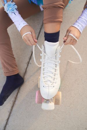 Anonymous person putting on roller skates