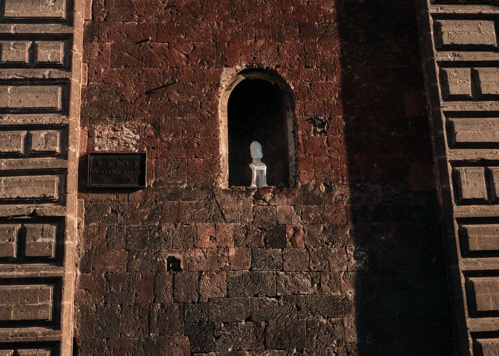 Bust in arched window