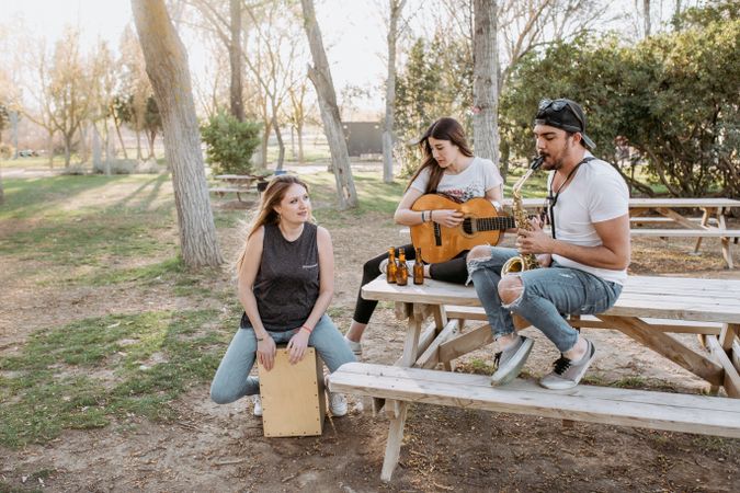 Cheerful musicians having fun in park