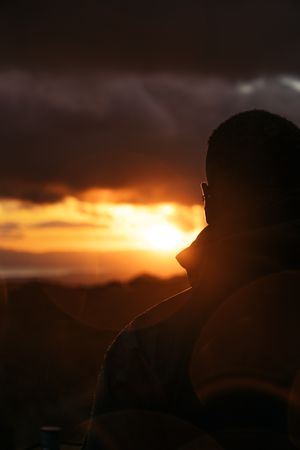Man watching the sunset in the countryside in Costa Rica