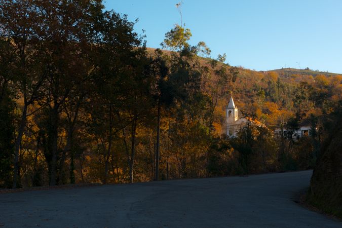 Road near church and autumn trees