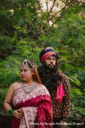 Indian woman in pink saree standing beside a man wearing turban 41vwZb