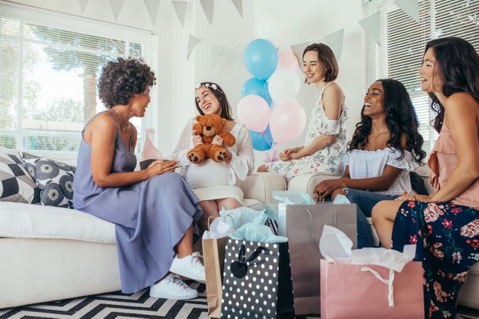 Woman celebrating baby shower with friends