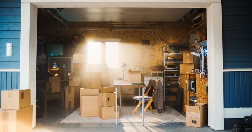 Establishing Shot Of Empty Work Desk Of Small Business Owner In Retro Garage.