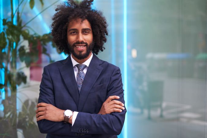 Successful Black businessman in suit smiling