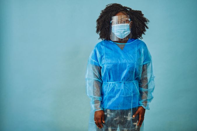 Black female medical professional wearing full PPE for surgery