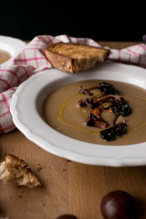 Bread and scallion near chestnut soup