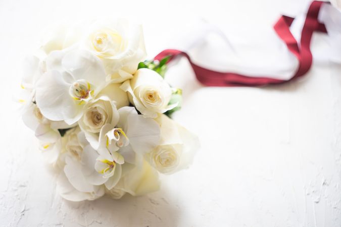 Wedding bouquet with roses and orchids