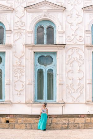 Woman leaving ornamental building