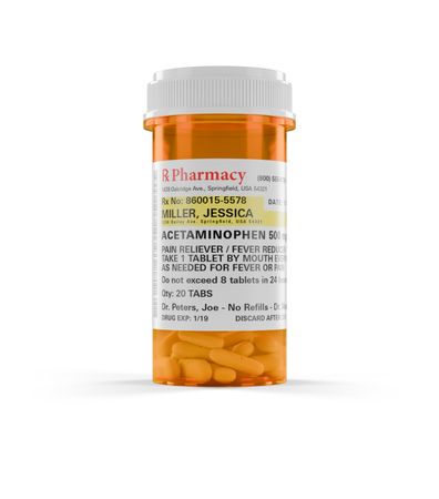 Acetaminophen Prescription Medicine Bottle and Pills Isolated on a blank Background.