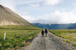 Back of two people on isolated trail