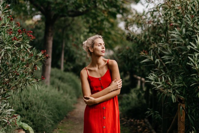 Dreamy woman in summer garden