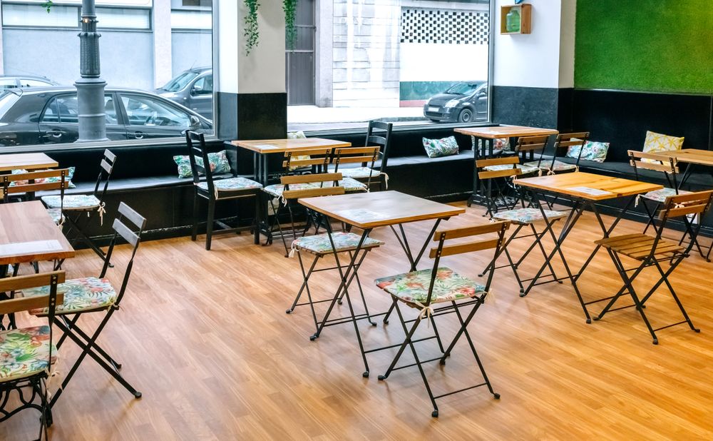 Empty coffee shop with tables and chairs