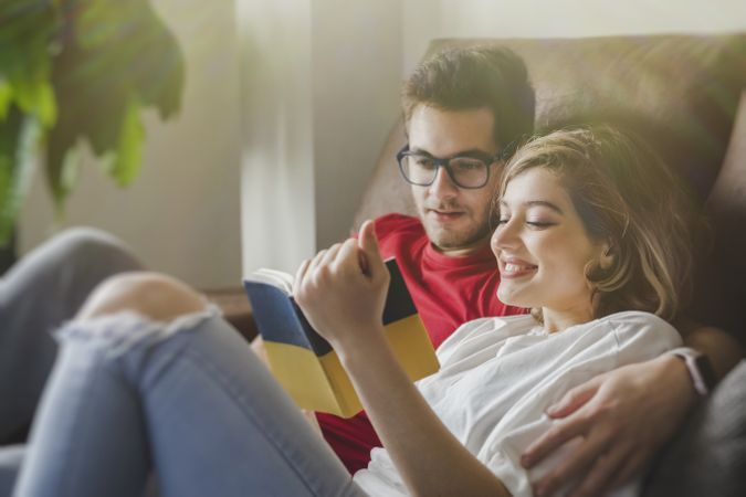 Dreamy couple with brochure
