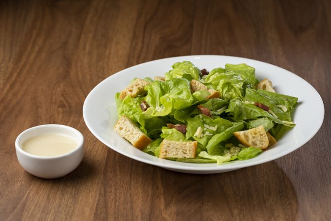 Caesar salad with croutons and bacon.