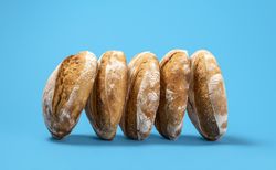 Homemade sourdough bread loaves on a blue background