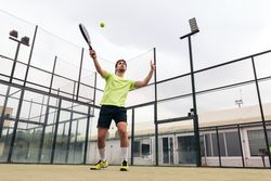 Young man playing paddle tennis