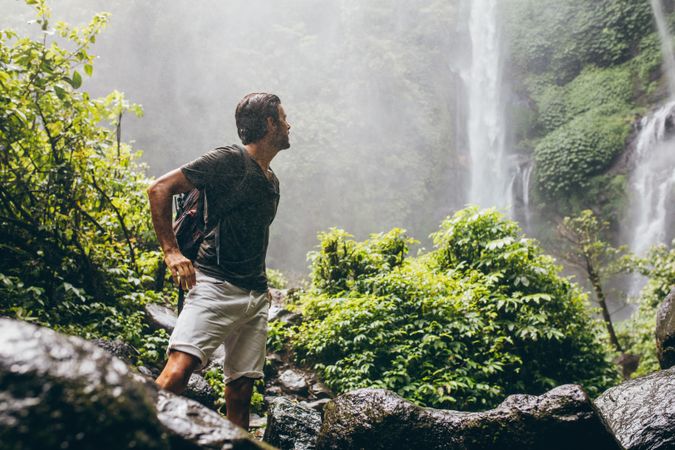 Male hiker in the nature during rain