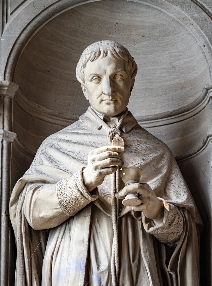 Ancient sculpture in one of the churches of Paris. Antique art.