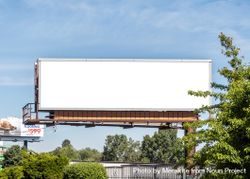 Digital billboard mockup next to road on nice day 5olz14
