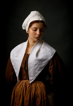 Medieval maid posing in studio