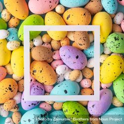 Easter composition made with colorful eggs and square outline 0KgpY0