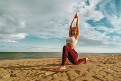 Woman Performing Yoga - Peaceful Pose - Seashore Setting
