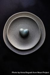 Table setting with grey plates and heart 5zrrQN