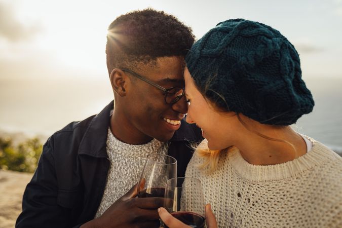 Loving couple enjoying wine and being affectionate