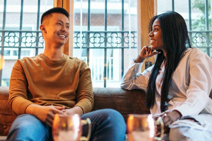 Asian man and Black Latina woman on a date