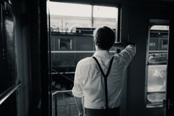 Traveler looking out train window