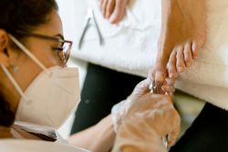 Toe nails being cut in professional spa