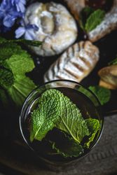 Traditional tea with mint and assorted Arab sweets