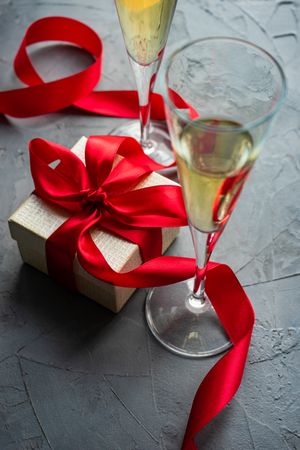 Gift box concept with two glasses of champagne