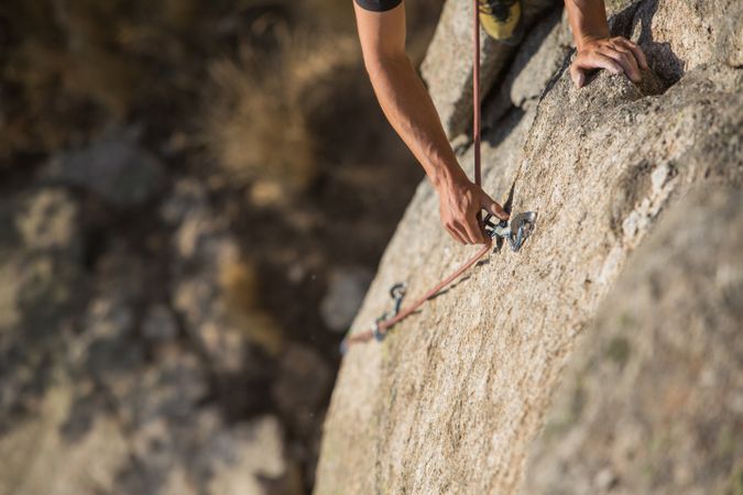 Man climbing a rock
