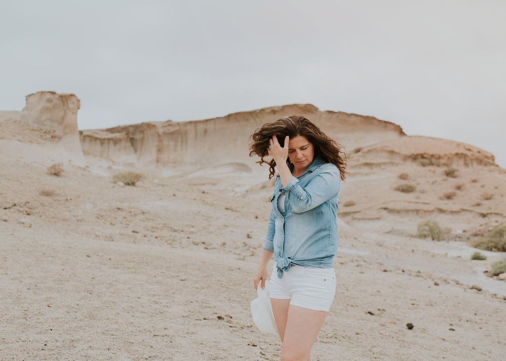 Female tourist walking on sandy quarry