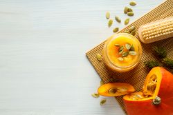 Skin care and face care concept - pumpkin cosmetic