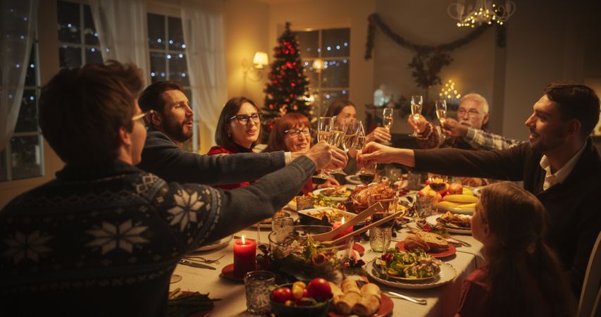 Christmas Dinner Together with Happy Parents, Children and Friends at Home.