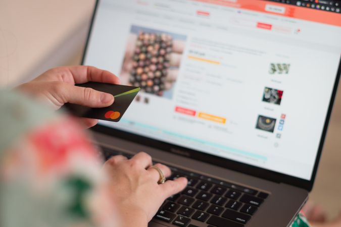 Online Shopping Using a Credit Card on a Laptop Screen