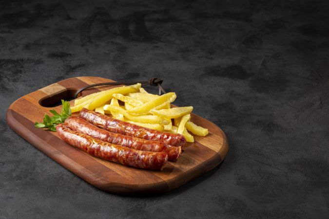 Grilled German sausage with french fries.