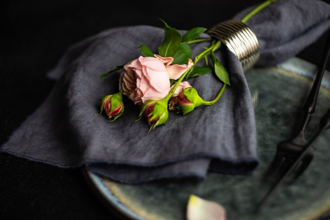 Flowers wrapped in navy napkin