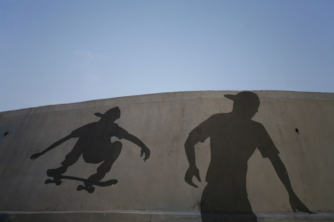 Shadow of two skateboarders