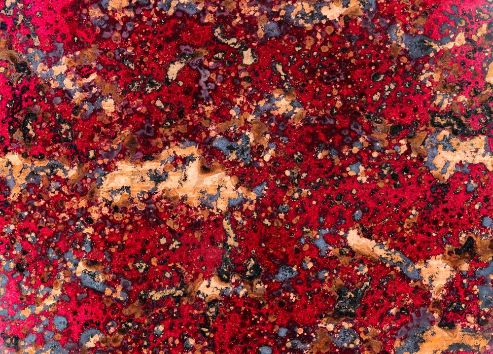 Toned copper metal background with patina texture in many colors