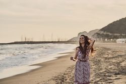 Woman with dress at the beach