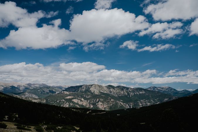 Landscape of majestic mountains under clouds