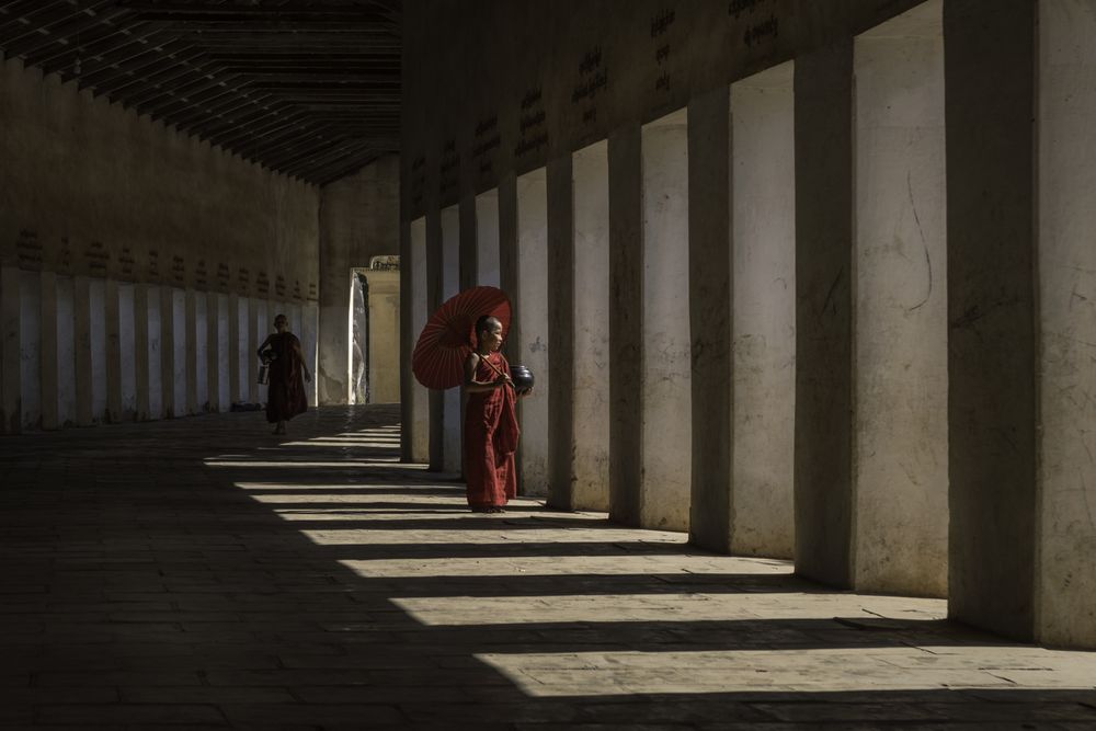 Buddhist monks in hallway in Myanmar